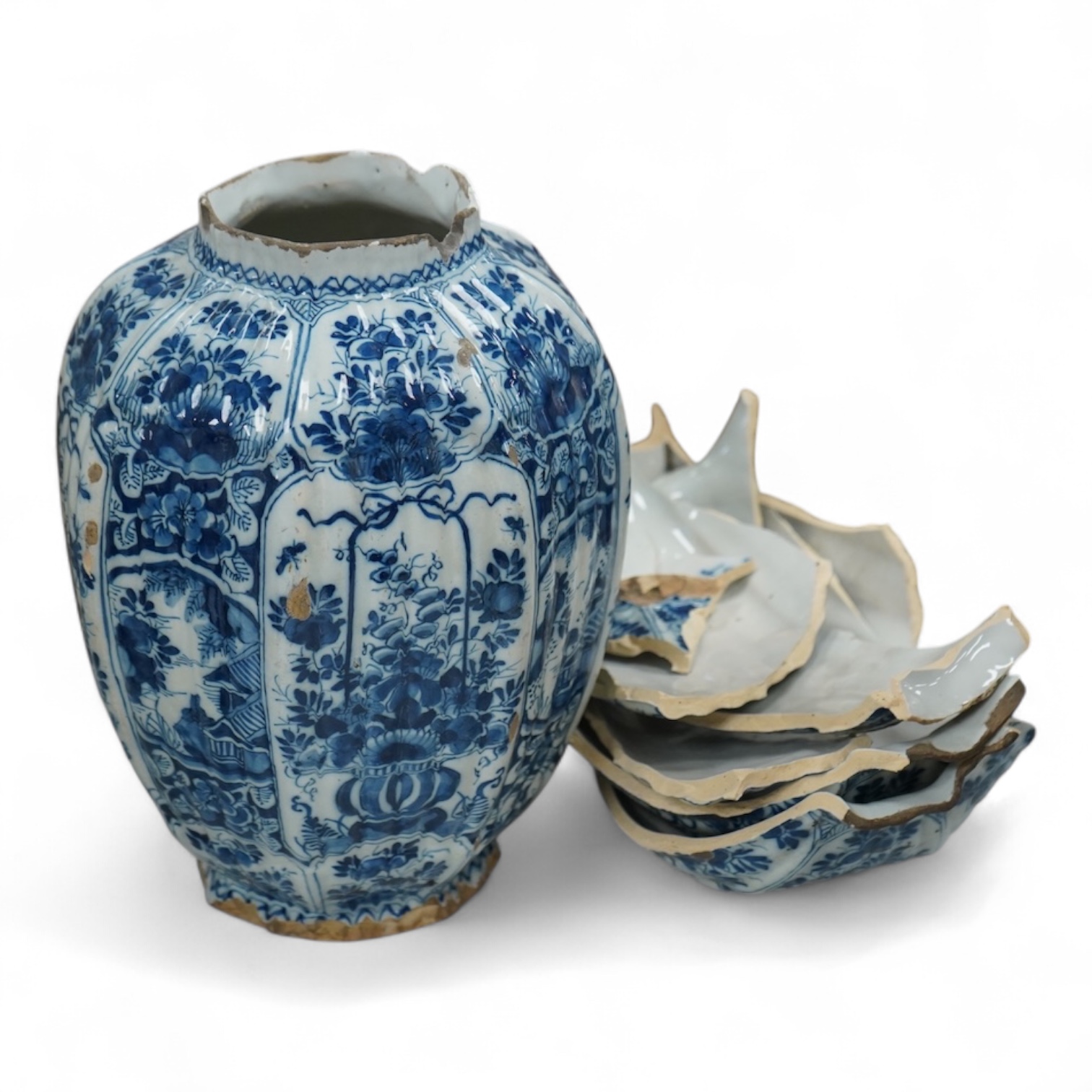 A late 17th century Delft faceted blue and white vase, by Lambartus van Eenhorn, and another broken similar, 29cm high (a.f.)